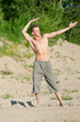 Young man running on beach Young man running on beach