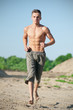 Young man running on beach Young man running on beach