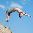 Excited young man jumping in air Excited young man jumping in air