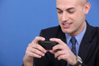 Young bald looking mobile phone screen