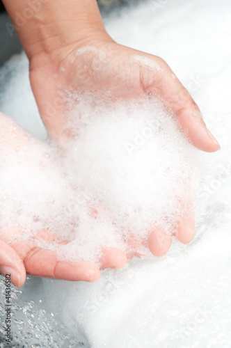 Photo: washing hands with soap under running water washing hands with soap under running water
