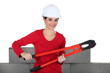 Woman holding large pliers Woman holding large pliers