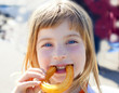 Blue eyes little girl eating churros smiling Blue eyes little girl eating churros smiling