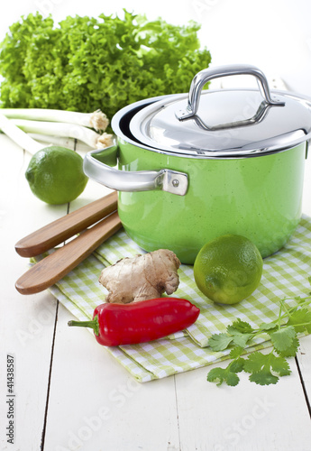 Photo: Green pot with lime, ginger, fresh coriander and chili pepper Green pot with lime, ginger, fresh coriander and chili pepper