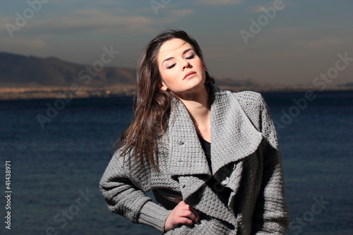 Photo: The happy young woman by the sea The happy young woman by the sea
