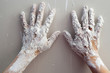 Astist plastering man hands with cracked plaster