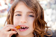 Blue eyes little girl eating churros fried crullers Blue eyes little girl eating churros fried crullers