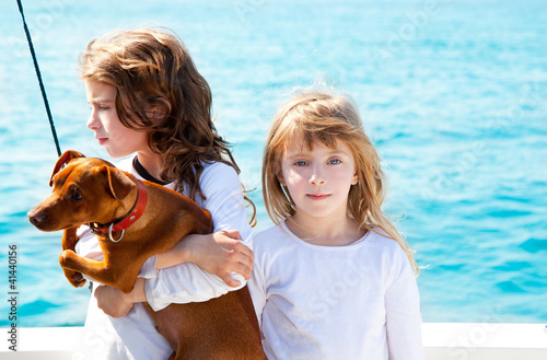 Photo: sister kid girls with dog on the sea sister kid girls with dog on the sea