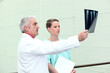 Doctor and his assistant examining an x-ray