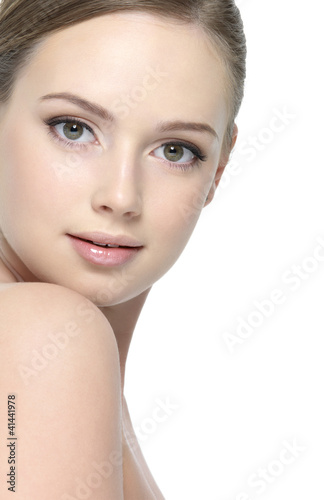 Photo: Face of beautiful young woman isolated on white Face of beautiful young woman isolated on white