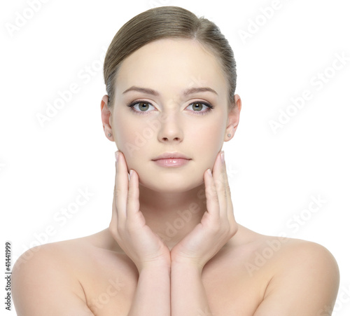 Photo: Beautiful face of young woman with clean skin Beautiful face of young woman with clean skin