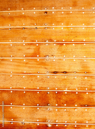 Photo: boat wooden hull texture detail with caulking putty boat wooden hull texture detail with caulking putty