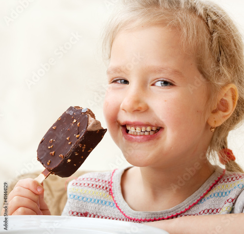 Photo: Girl eating ice cream Girl eating ice cream