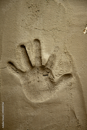 Photo: hand print on cement mortar wall hand print on cement mortar wall
