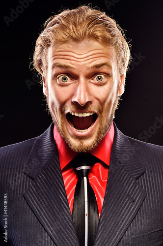 Photo: portrait of young man shouting portrait of young man shouting