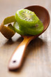 Slices of fresh kiwi on the wooden spoon,shallow depth of field