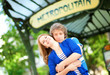 Photo: Young beautiful couple in Paris at the entrance to metro station Young beautiful couple in Paris at the entrance to metro station
