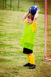 Young child boy playing soccer during organized league game Young child boy playing soccer during organized league game