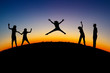 silhouette of teens on hill in sunset silhouette of teens on hill in sunset