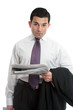 Businessman with financial news