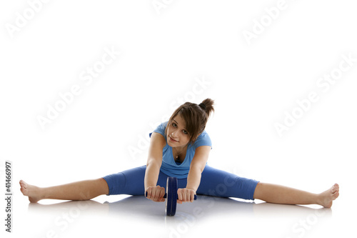 Photo: Girl with a gymnastic roller Girl with a gymnastic roller