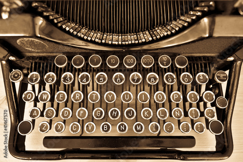 Photo: Antique typewriter on sepia Antique typewriter on sepia