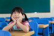 Little Girl are Thinking in the classroom of school Little Girl are Thinking in the classroom of school