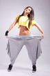 young woman dancer pulling her pants