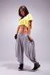 young sporty woman in a shy pose