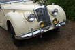 front of a classical car