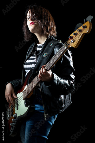 Photo: Rock Woman Playing Electric Bass Guitar Rock Woman Playing Electric Bass Guitar