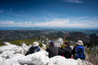 Foto: group mountaineers resting on the top of the hill group mountaineers resting on the top of the hill