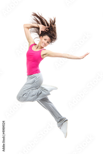 Photo: Modern teenage girl dancer jumping and dancing Modern teenage girl dancer jumping and dancing