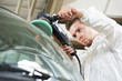 auto mechanic polishing car