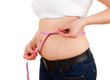 overweight, fat  woman measuring her stomach
