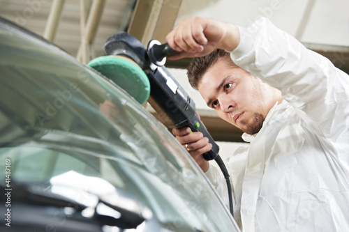 Photo: auto mechanic polishing car auto mechanic polishing car