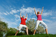 Photo: Young man and woman doing stretching exercises Young man and woman doing stretching exercises
