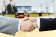 Closeup of businessmen and businesswoman shaking hands Closeup of businessmen and businesswoman shaking hands