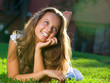 Beautiful Girl lying on the Field. Happiness