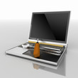 laptop with screwdriver and wrench