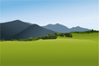 Mountain landscape with green field