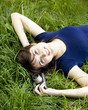 Teen girl with camera at the green park.