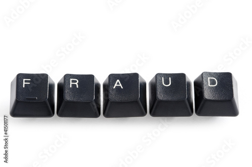 Photo: computer keys spelling the word fraud on white computer keys spelling the word fraud on white