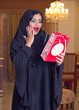 beautiful arabian lady happy for receiving a gift
