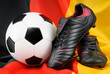 Photo en ligne au meilleur prix Fu�ball und Schuhe auf deutscher Flagge