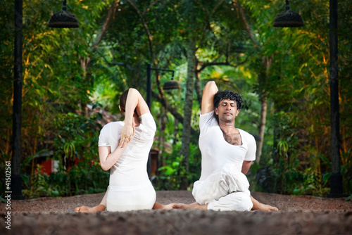 Photo: Couple yoga gomukhasana cow pose Couple yoga gomukhasana cow pose