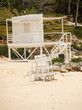 White Wood Stands and Lifeguard Chair on Beach White Wood Stands and Lifeguard Chair on Beach