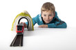 boy playing with a train