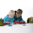 boys are playing with a train
