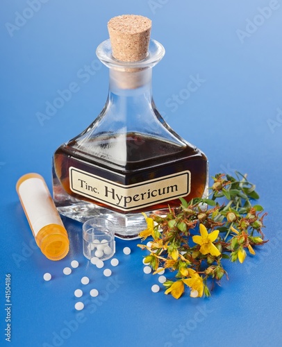 Photo: Hypericum plant and extract and homeopathic pills Hypericum plant and extract and homeopathic pills